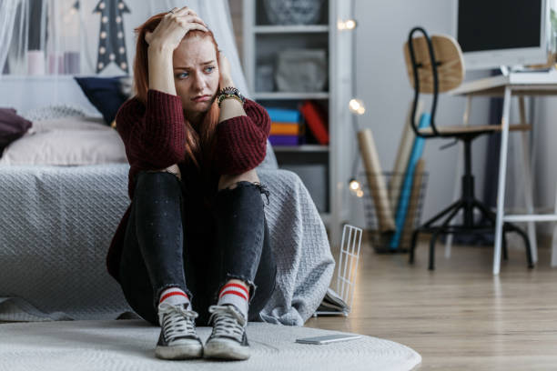 teen on bed, stressed needing support
