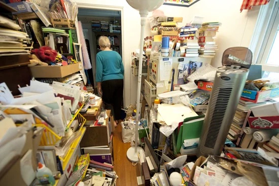 Cluttered room representing hoarding behaviours and feeling overwhelmed