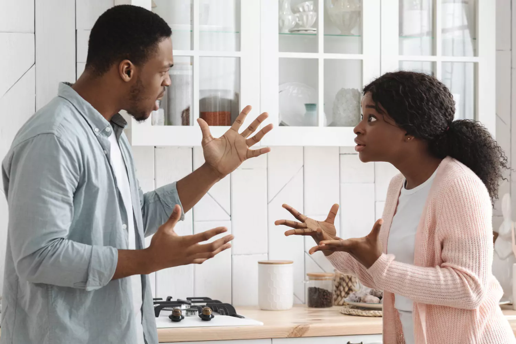 Couple having an emotional conversation in counselling